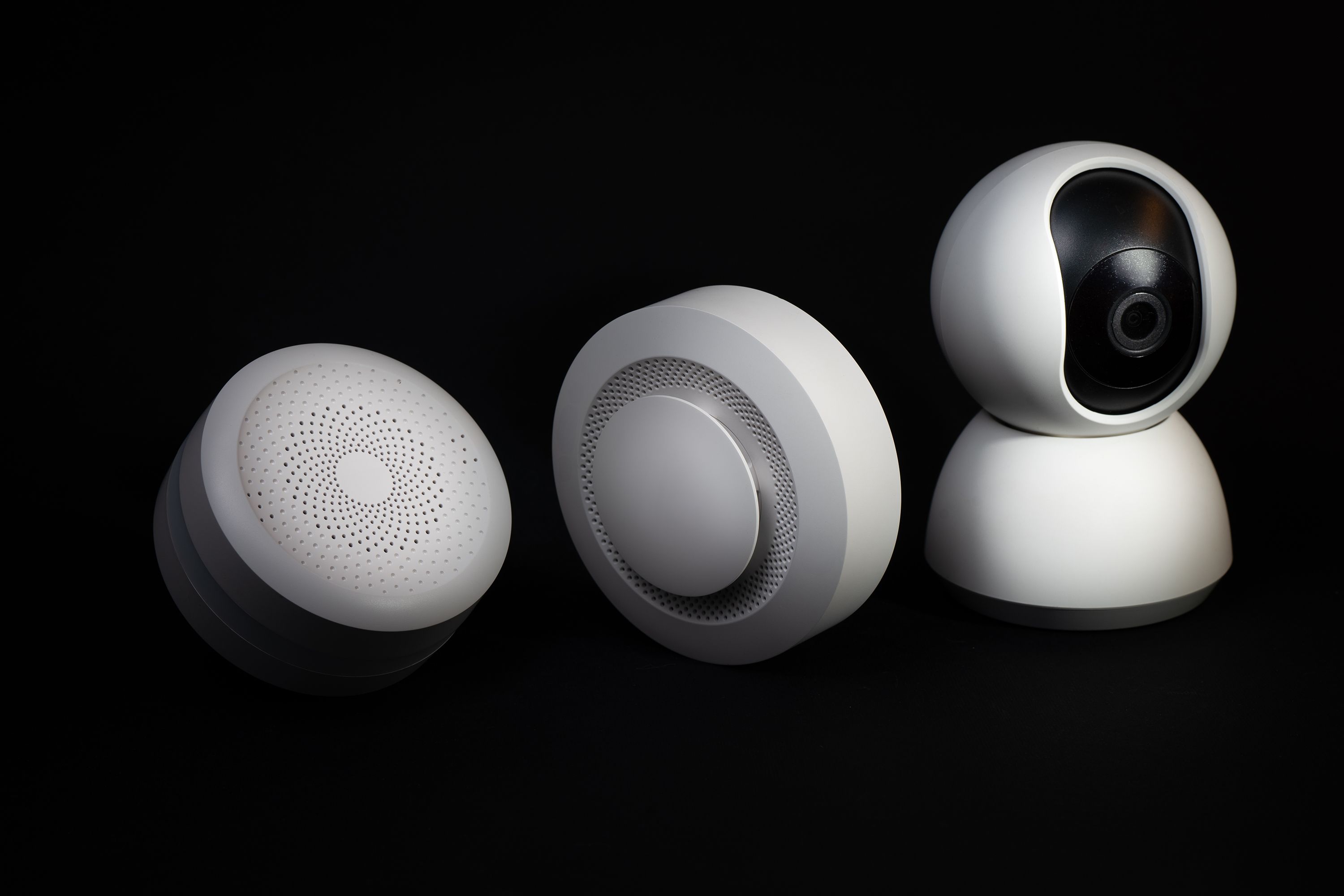 Elegant and innovative home automation devices on a sleek black background, showcasing modern technology.