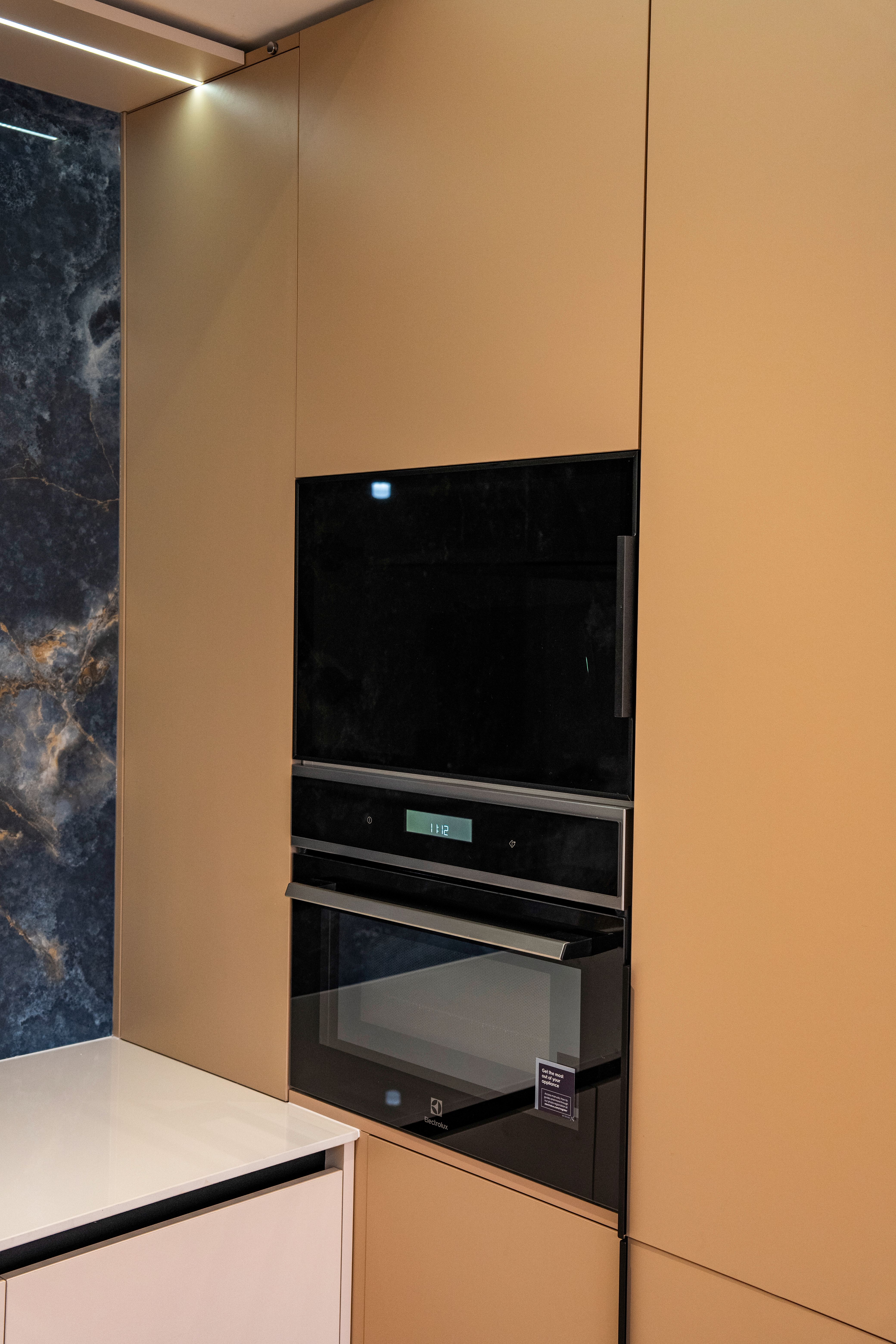 Sleek built-in oven in a modern kitchen setting featuring minimalist design.