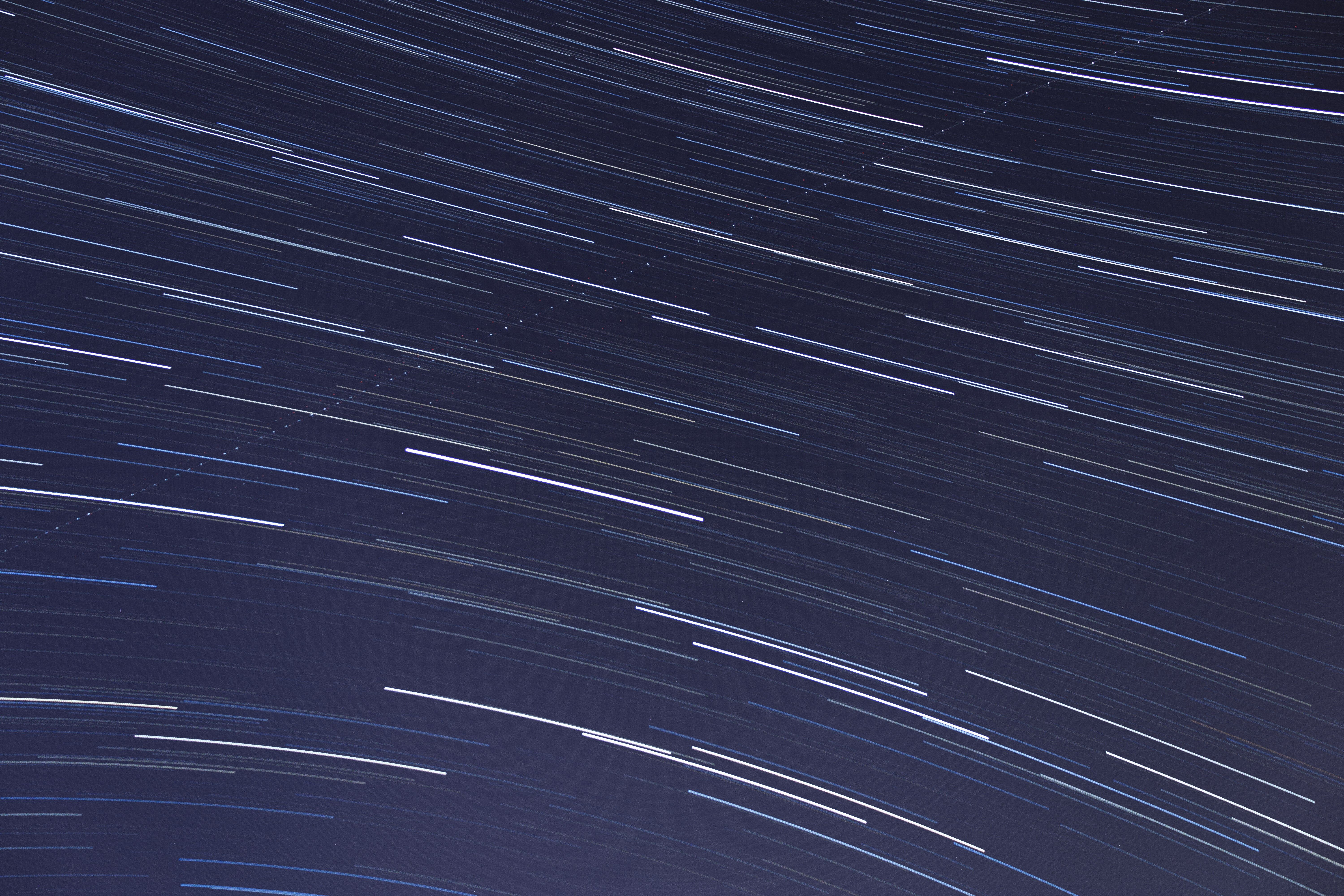 A stunning capture of star trails using long exposure photography, showcasing motion and light streaks.